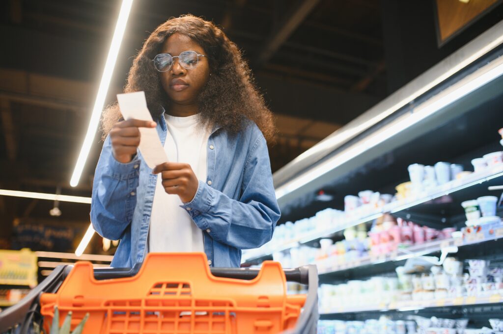 Woman making tough choices between how she can afford food and healthcare items with her employee benefits